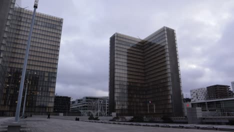Slow-pan-wide-shot-of-France-national-library-François-Mitterand-towers-during-overcast-day