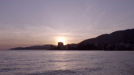 The-sunset-over-the-beautiful-waves-and-shoreline-of-North-Vancouver---wide