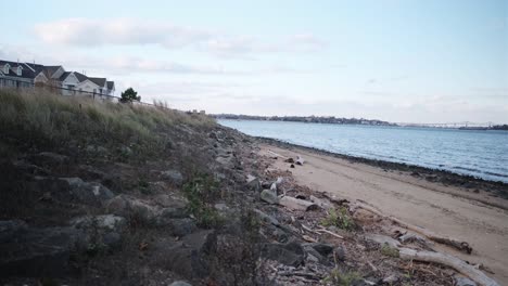 Wide-shot-of-the-raritan-bay-beach-and-water-front-apartments-on-an-early-evening