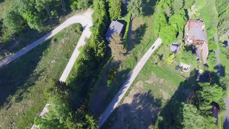 drone-shot-of-motorcycle-on-road-with-trees