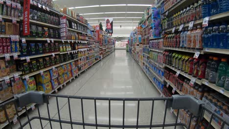 POV-from-the-shopping-cart-while-going-through-the-drink-aisle-at-the-supermarket