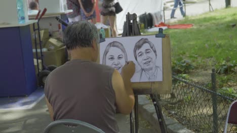 Artista-Pintando-Retratos-Para-Turistas-En-Las-Calles-De-La-Ciudad-De-Berlín,-Alemania