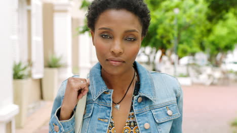 Young-black-female-student-standing-outside