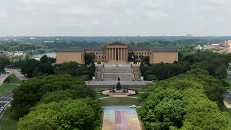 Rising-aerial-of-Philadelphia-Museum-of-Art-and-famous-Rocky-Steps,-Schuylkill-River-on-summer-day