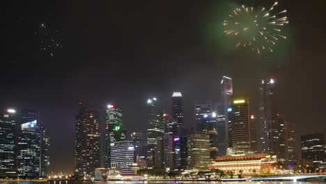 Panorama-shot-of-Singapore-Skyline-at-night-during-city-celebration-with-fireworks,static