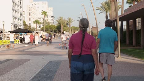 Pedestrians-walking-the-sidewalk-at-Qiarteor-beach-during-the-covid-pandemic