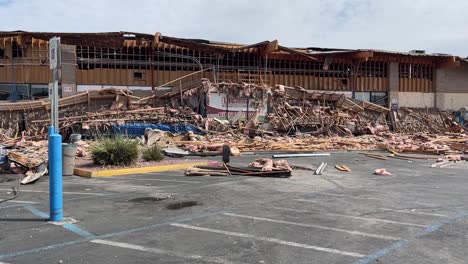 Panning-shot-of-grocery-storefront-collapse