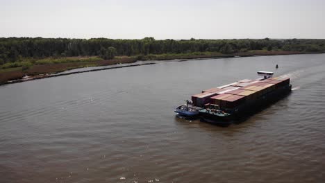 Inland-Vessel-Loaded-With-Intermodal-Containers-Sailing-On-River