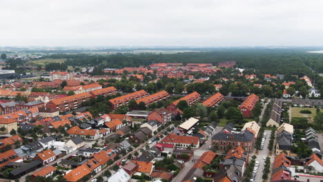 Majestic-city-of-Ystad-in-Sweden-with-colorful-rooftops,-high-angle-drone-view