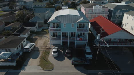 Three-story-housing-in-Kure-Beach-Northern-California-Aerial-4k-Rise-up