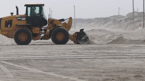 Caterpillar-wheel-loader-moving-sand-to-repair-damage-to-the-beach-and-dunes-sustained-in-Hurricane-Harvey-in-Aug-2017