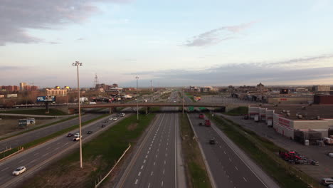 Aerial-view-of-highway,-cars-passing,-suburban-traffic,-bridge,-transportation,-early-morning-view