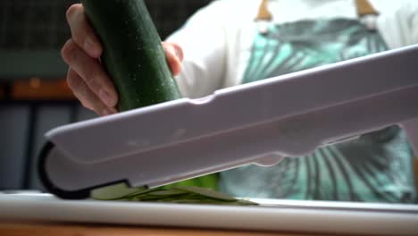 Chef-Cutting-Cucumber-with-mandolina-in-slow-motion