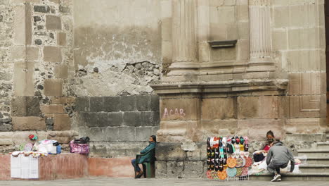 Street-sellers,-hawkers,-vendors-in-Mexico-sell-their-products-on-the-steps-of-a-church