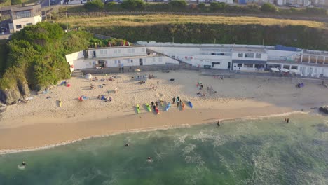 Pro-surfers-community-get-together-at-Marazion-England-aerial