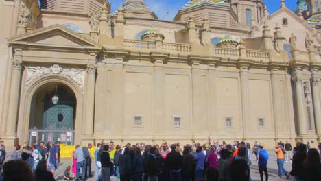 People-At-Plaza-del-Pilar-Visiting-Cathedral-Basilica-of-Our-Lady-of-the-Pillar-During-Famous-Annual-Fiestas-del-Pilar-In-Aragon,-Spain