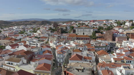 Aerial-View-Of-The-Medieval-Town-Of-Silves-In-Algarve,-Portugal---drone-shot