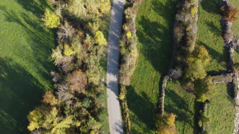 Aerial-view-of-country-road-in-autumn-fall-season-in-early-morning