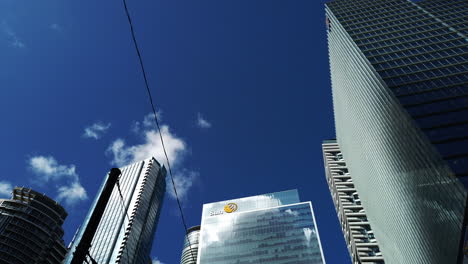 Wide-moving-shot-looking-up-at-corporate-buildings-in-downtown-Toronto