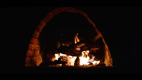 steady-cam--arch-shaped-brick-fireplace-with-wood-burning-inside,front-view