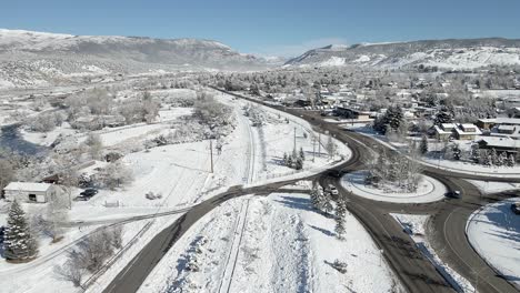 Flying-over-a-round-about-in-the-town-of-Eagle-with-fresh-snow-during-the-month-of-December