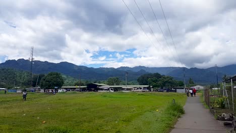 Daily-scenes-in-Arawa-township-with-fruit-and-vegetable-market-in-the-background-on-the-remote-tropical-island-of-Autonomous-Region-of-Bougainville,-Papua-New-Guinea