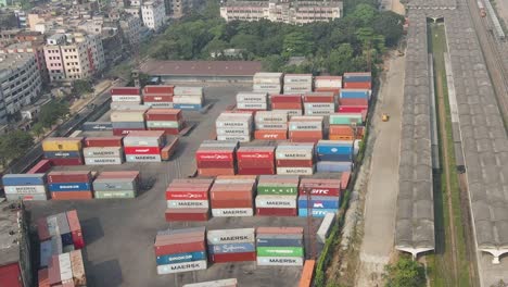 Aerial-view-forwarding-shot-of-Dhaka-Inland-Container-Depot-in-Steamer-ghat-beside-railway-station-for-transportation-of-the-containers-on-a-sunny-day