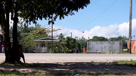 Daily-traffic-scene-on-the-main-street-in-Buka-town-on-the-tropical-island-of-Autonomous-Region-of-Bougainville,-Papua-New-Guinea