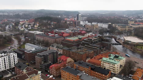 Colorful-downtown-buildings-of-Swedish-town-city-center,-aerial-drone-view