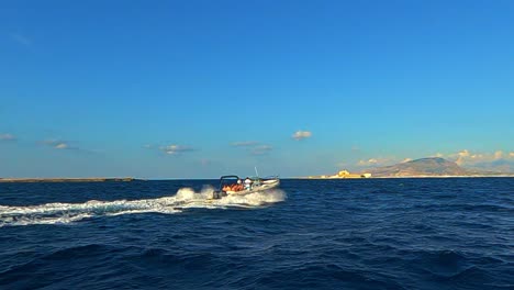 Approaching-Isola-di-Formica-island-with-fast-dinghy-rubber-boat,-Italy