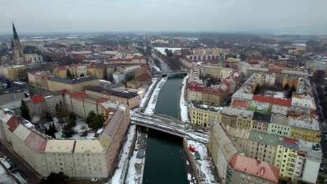 Aerial-view-of-the-city-of-Olomouc-in-Moravia-in-the-Czech-Republic-with-falling-snow-in-winter