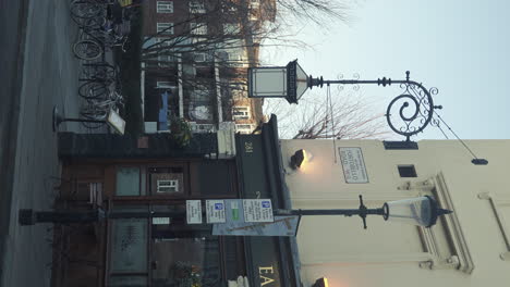 Vertical-Dolly-Right-Shot-of-Lively-Earl-of-Lonsdale-Corner-with-an-Classic-Lamp-in-Portobello-Road
