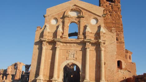 Church-of-San-Martin-de-Tours,-Belchite-Old-Town-Ruins-of-the-Spanish-Civil-War,-Zaragoza,-Aragon,-Spain---tilt-up-shot