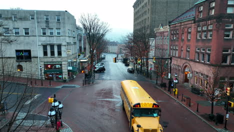 School-bus-drives-through-historic-town-in-USA-decorated-for-Christmas