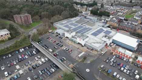 Sainsburys-supermarket-Harlow-Essex-UK-rising-crane-shot-Aerial-drone-pull-back-reveal-footage-4K