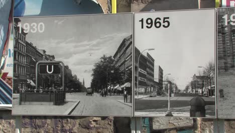 Historic-photographs-of-former-Berlin-wall-put-up-near-Bernauer-Straße-Memorial,-Berlin,-Germany