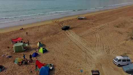 Aerial-View-Of-Tents-And-Vehicles-On-Beach-At-Balochistan