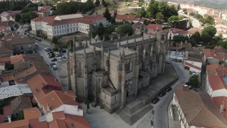 Aerial-parallax-view-Guarda-city-Cathedral-ancient-Landmark,-historic-downtown---Portugal