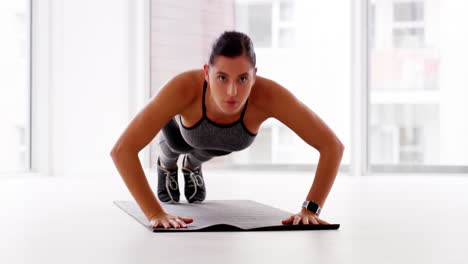 a-sporty-young-woman-doing-pushups