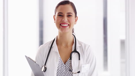 a-young-female-doctor-standing-with-a-clipboard