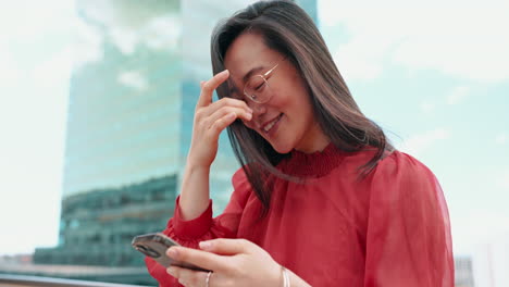 Asian-woman,-phone-and-happy-typing-city