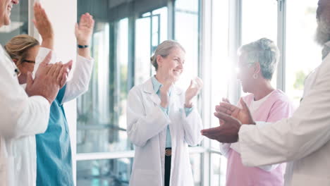 Doctor,-nurse-and-team-applause-in-celebration