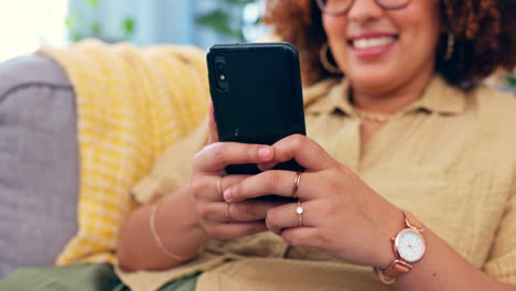 Hands,-phone-and-black-woman-laughing-on-sofa