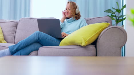 Laptop,-headphones-and-woman-listening-on-couch