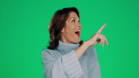 Woman,-happy-and-green-screen-pointing-at-space