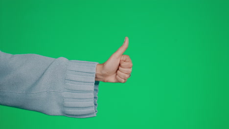 Hand,-thumbs-up-and-approval-on-a-green-screen