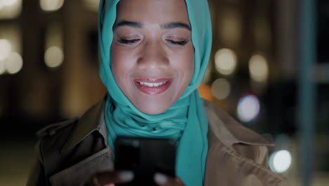 Night,-phone-and-texting-with-muslim-woman-in-city