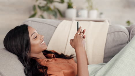 Woman,-phone-and-chatting-relaxing-on-living-room