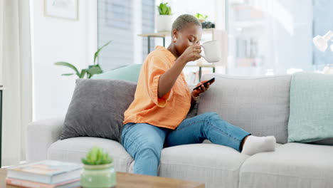 Coffee,-relax-and-black-woman-with-phone-on-sofa