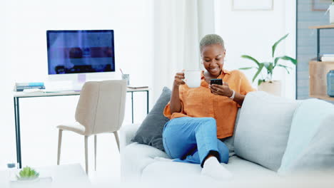 Black-woman,-coffee-and-texting-with-phone-on-sofa